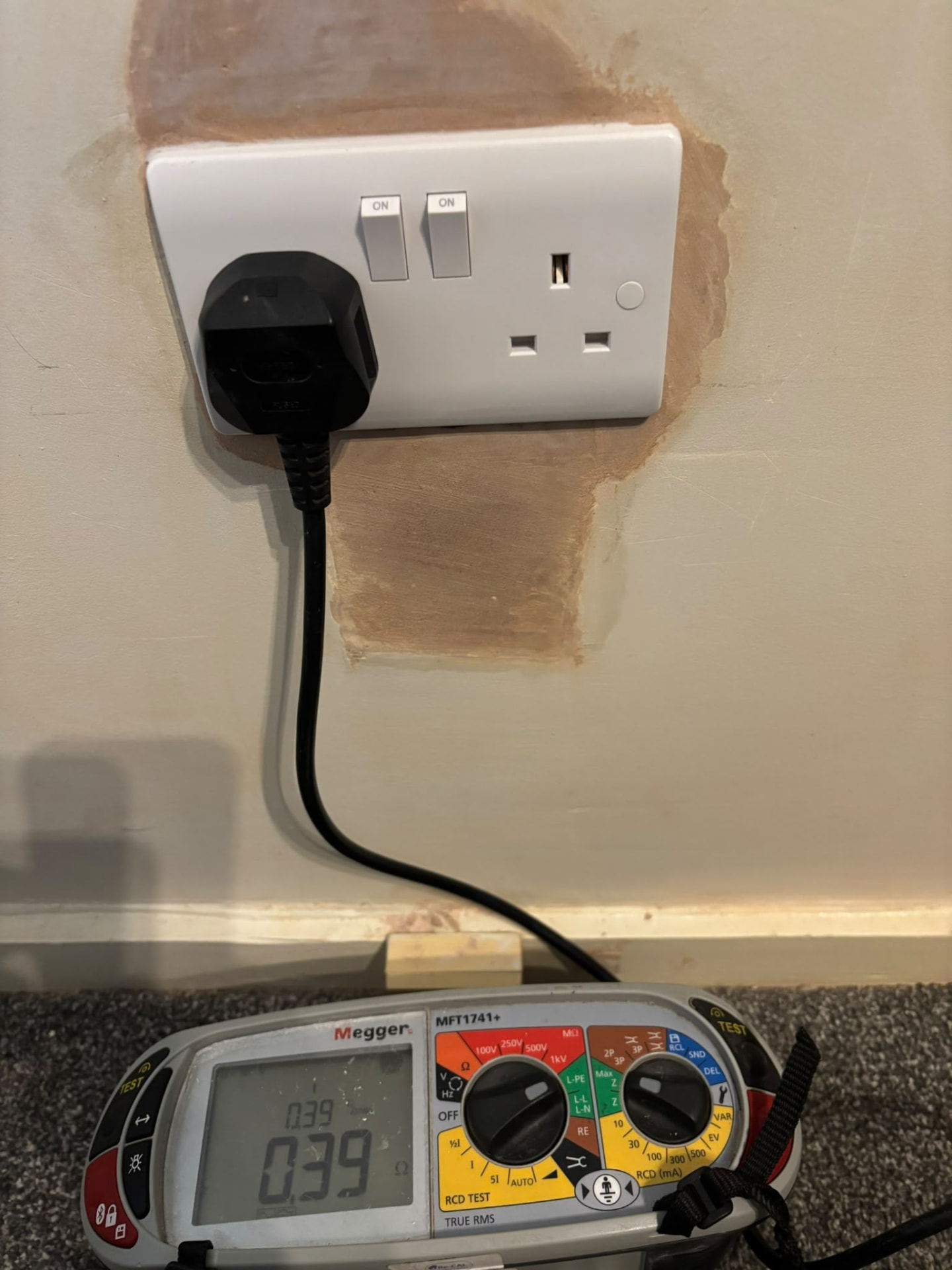Megger socket tester in use during an EICR electrical installation condition report